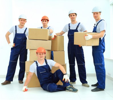 Careful unloading of household furniture during a Shepherds Bush move