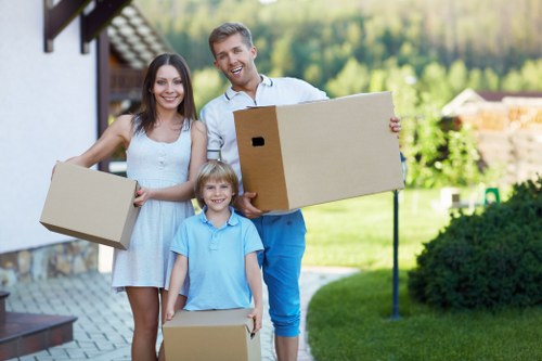 Commercial removals team handling desks and equipment in Shepherds Bush