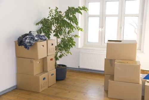 Packed moving boxes and household items ready for collection in West London