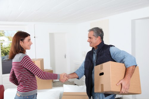 Local movers handling boxes and furniture for a home move