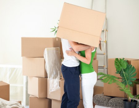 Careful loading of sofas and household furniture into a removals van
